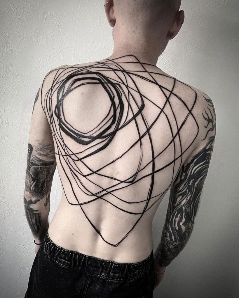 Abstract Sun Back Tattoo | Photos Tattoo Ideas For Men